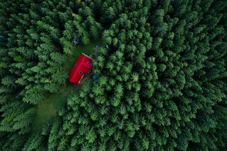 Fairy-tale little house in the woods taken from a drone.の写真素材