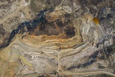 Aerial view of an open mine pit. Exploitation and nature pollutionの写真素材