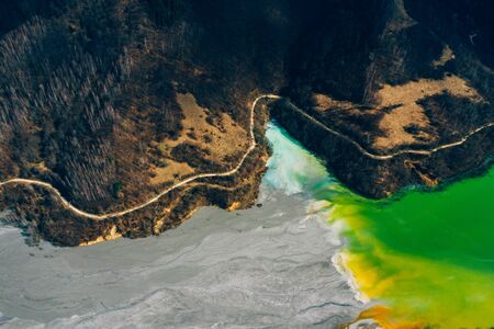 Drone view of contaminated, toxic water stream in Geamana, Romaniaの写真素材