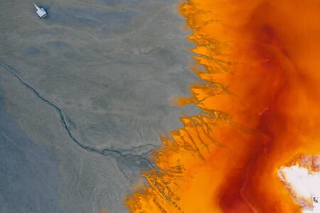 Drone view of contaminated, toxic water stream in Geamana, Romaniaの写真素材