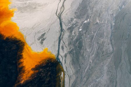 Drone view of contaminated, toxic water stream in Geamana, Romaniaの写真素材