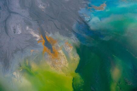 Drone view of contaminated, toxic water stream in Geamana, Romaniaの写真素材