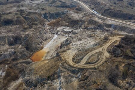 Aerial view of an open mine pit. Exploitation and nature pollutionの写真素材