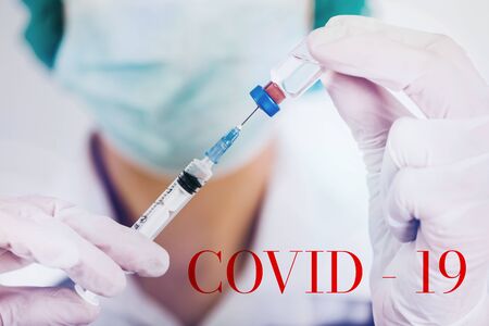 Healthcare and medical image with doctor and protection mask, vaccines an stethoscope. Covid-19 concept.の写真素材