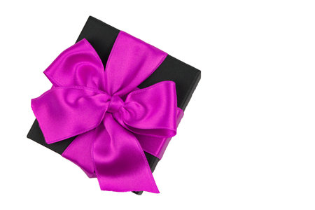 Black gift box with purple ribbon bow isolated on white background with clipping pathの写真素材