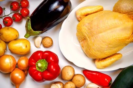 vegetables and chicken on a white background, close-upの写真素材