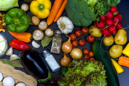 vegetables and spices on a black background, top view,の写真素材