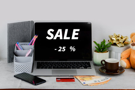 Laptop with sale sign on the screen. Shopping online concept.の写真素材