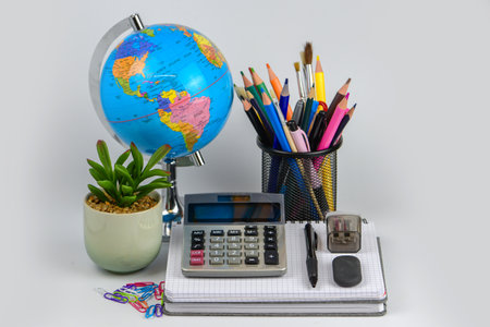 Back to school concept with globe, notebook, pencils and calculatorの写真素材