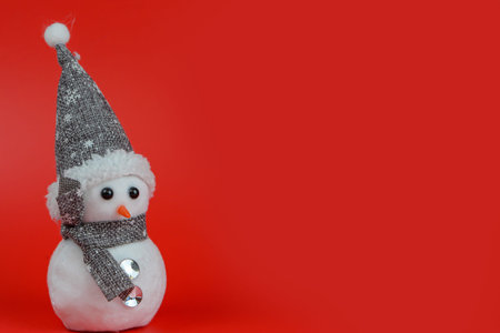 Snowman on a red background with copy space for your text.の写真素材