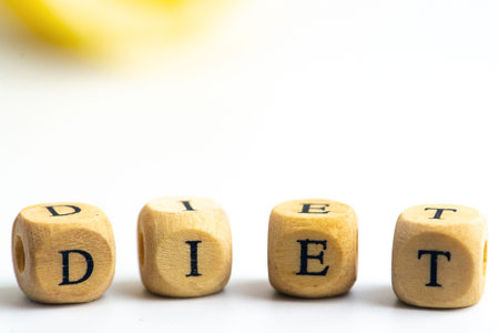 Diet word on wooden cube. Dieting and nutrition concept.