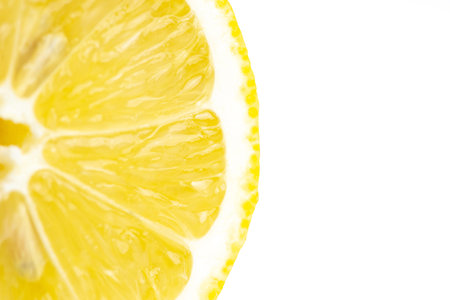 Lemon slice on white background. Close-up. Macro.