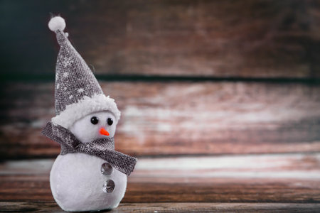 Snowman on a wooden background. Christmas card. New Year card.の写真素材