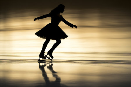 Girl skating on skating rink, figure skating. High quality photoの素材