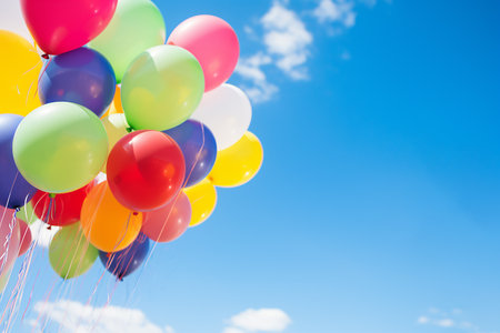 many colorful balloons flying into the sky with space for text. High quality photoの素材