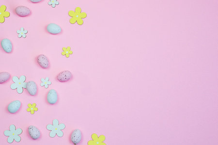 Easter pink background with bright colored eggs and space for text. High quality photo