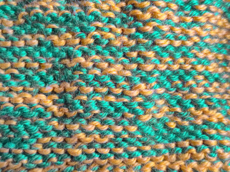 This is a beautifully textured knitted fabric that features vibrant and striking green and yellow...