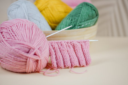 Vibrant and colorful yarn balls along with knitting techniques inspire creativity in the diverse textile craftsの写真素材