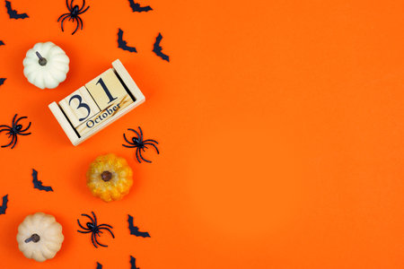bright orange background for Halloween with pumpkins, spiders and space for text.の写真素材