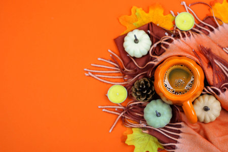 Embrace the warm autumn vibes with beautiful pumpkins, a cozy scarf, and colorful, seasonal leaves...