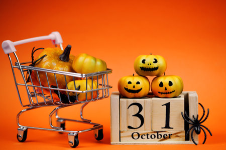 Exciting and Fun Halloween Decorations Featuring Colorful Pumpkins and a Shopping Cartの写真素材