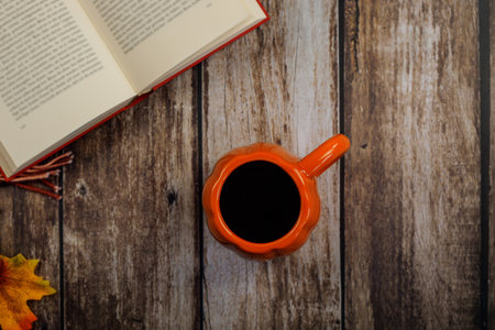 Embrace the Cozy Autumn Vibes with a Warm Mug of Coffee and a Good Book for Relaxationの写真素材