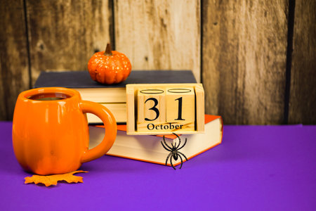 Coffee cup with autumn decor and wooden calendar. High quality photoの写真素材