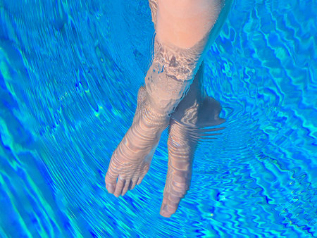 An elegant underwater shot beautifully showcases feet, reflecting tranquility and peaceの写真素材