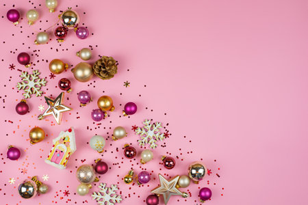 Festive ornaments and beautiful decorations on a pink background to spread holiday cheerの写真素材