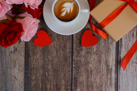 Coffee with gifts and flowers on a wooden table with space for text, Valentine's Day concept. High quality photoの写真素材