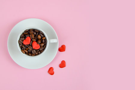Ceramic cup with hearts on pink background. Valentine's day concept. High quality photoの写真素材