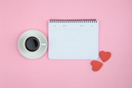 Cup of coffee with hearts on color background. High quality photoの写真素材