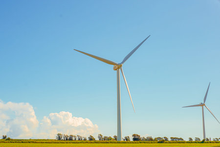 Giant Turbine Blade Dominating Open Field Foreground, LowAngle Perspective Highlights Engineering...