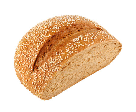 A loaf of homemade bread with sesame seeds isolated on white background