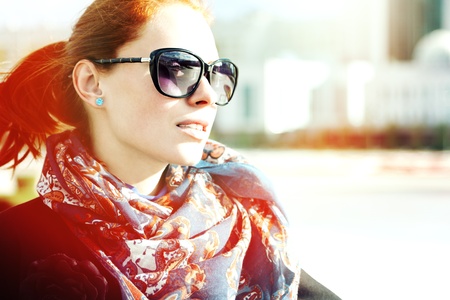 Portrait of an attractive young woman in sunglasses outdoorsの写真素材
