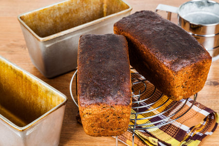 Homemade rye pan bread cools on the grill after baking