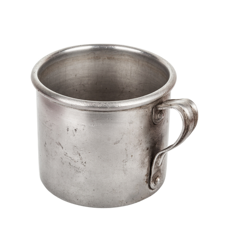 Old aluminum mug isolated on white background closeupの写真素材
