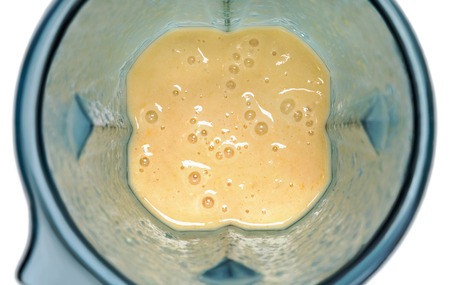 Tonifiyng smoothie. Smoothie in blender with white background toの写真素材