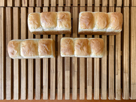 Freshly baked bread on a wooden table.