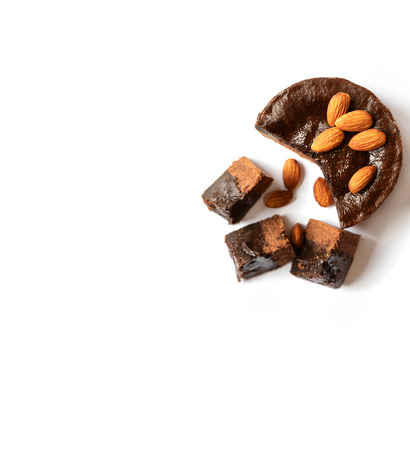 Chocolate cake with almonds on a white background.の写真素材