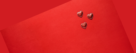 Sparkle hearts on red background. Valentine's day background.の写真素材