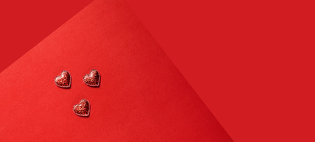 Sparkle hearts on red background. Valentine's day background.の写真素材