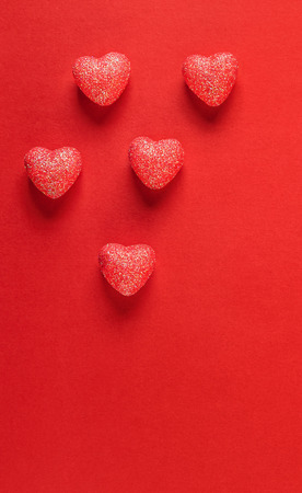 Sparkle hearts on red background. Valentine's day background.の写真素材