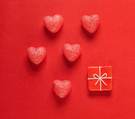 Sparkle hearts and toy present on red background. Valentine's day background.の写真素材