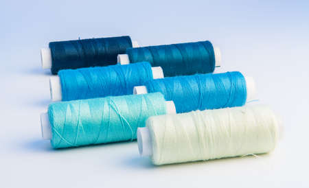 thread bobbins on white backgroundの写真素材