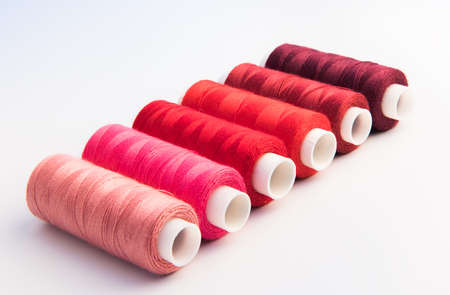 thread bobbins on white backgroundの写真素材