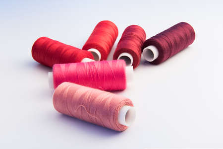 thread bobbins on white backgroundの写真素材