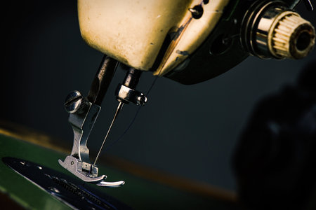 Old Sewing Machine - macro photo background - industry