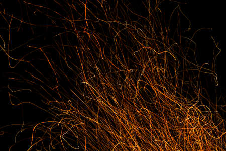 Dancing flames and sparks isolated on black - Dance of fireの写真素材
