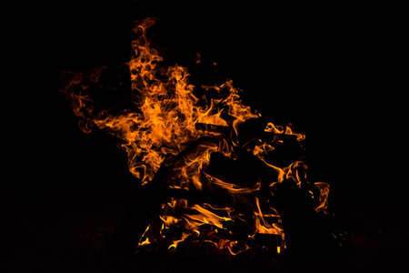 firewood in the bonfire with fire and sparks - backgroundの写真素材